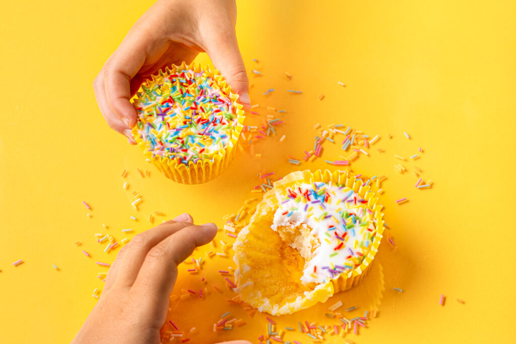 2 children about to eat cupcakes