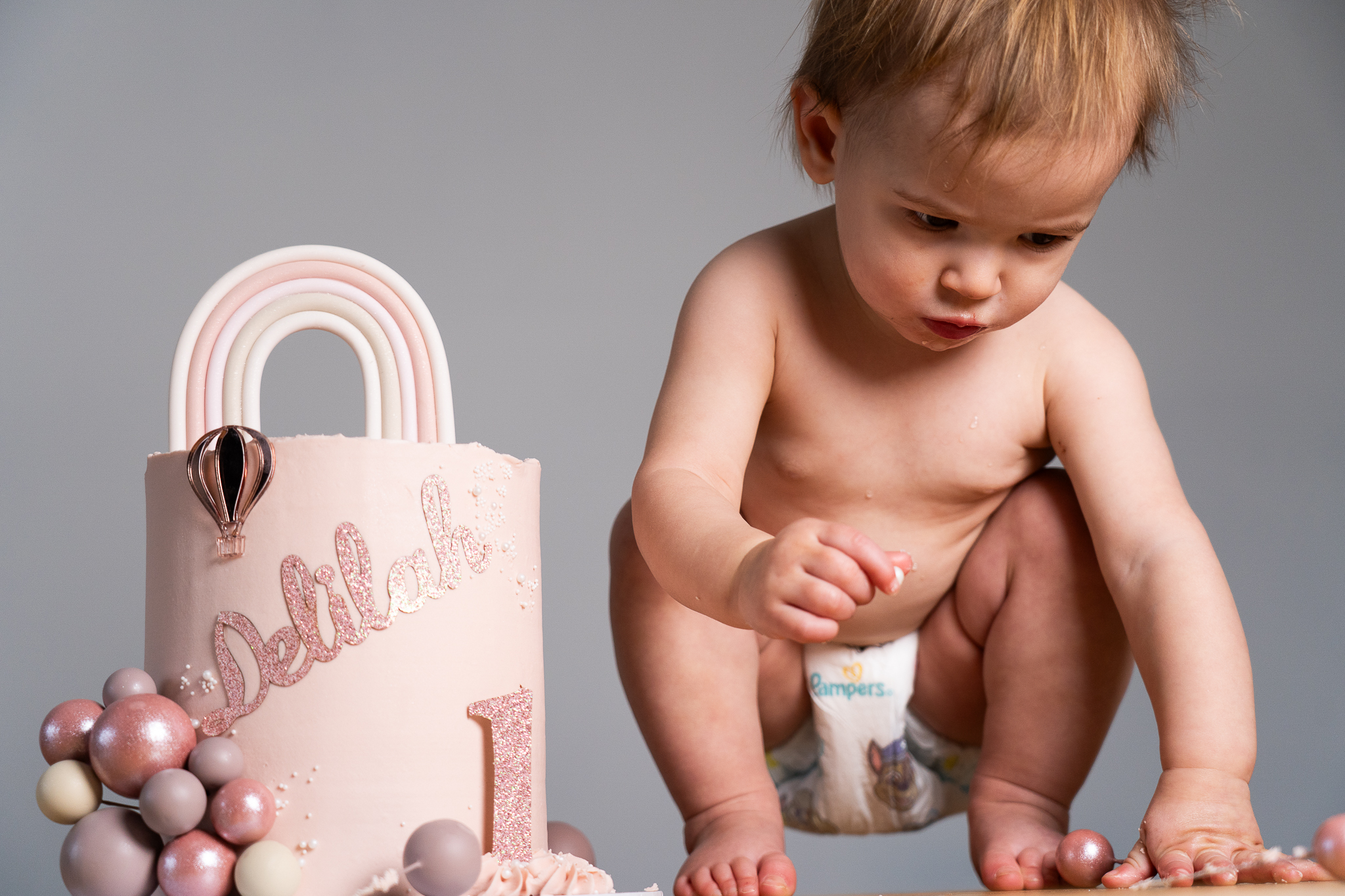 A baby with her 1st birthday cake