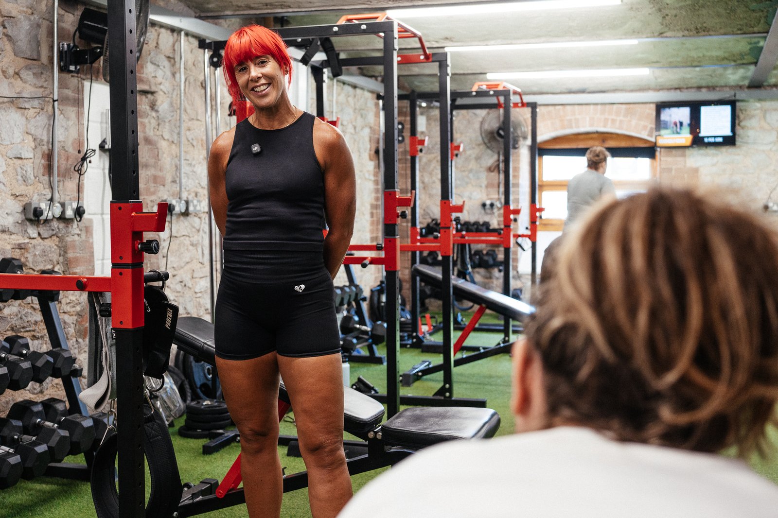 A PT coaching a client at a gym in Newton Abbot