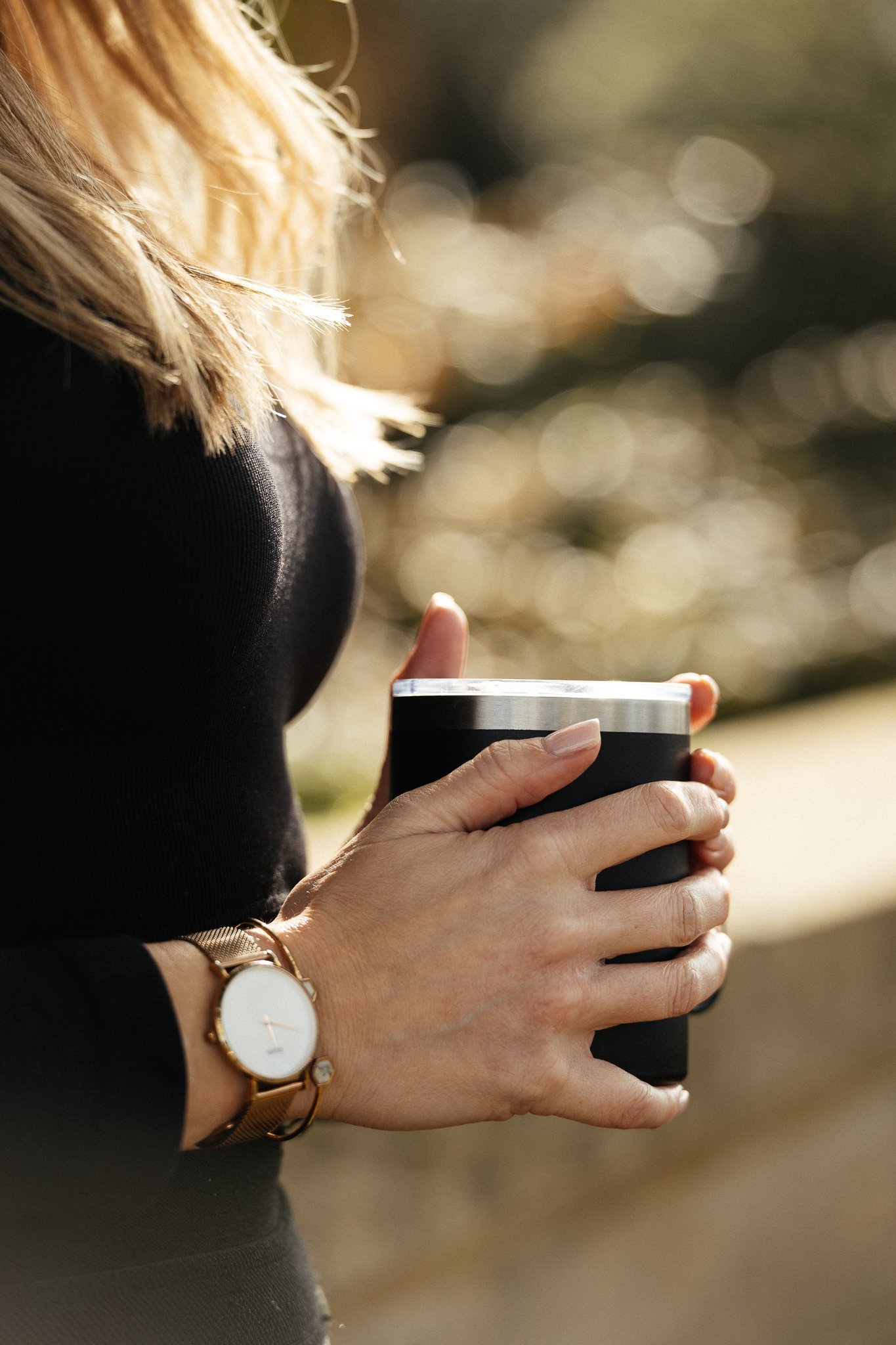 Woman seated outdoors during a personal branding video shoot in South Devon